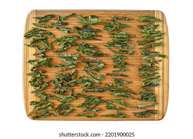 Twisted Fermented Currant, Grape, Tea Leaves Are Dried On A Wooden Cutting Board. Top View With Copy Space