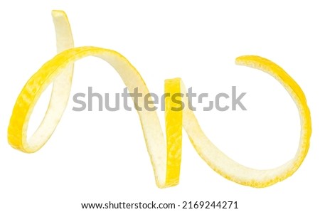 Twisted lemon peel isolated on a white background, clipping path. Ripe lemon skin.