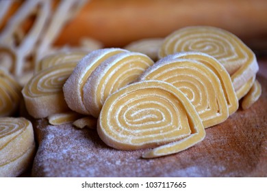 Twisted sliced dough to make homemade pasta - Shutterstock ID 1037117665