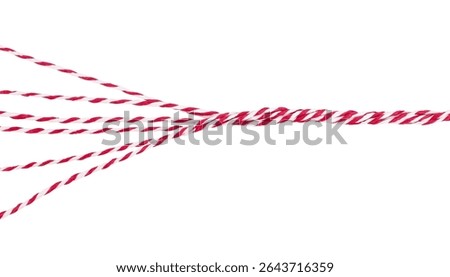 Twisted Threads. Red and white yarn isolated on white background. Stock photo.