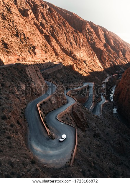 Twisting road in mountain landscape.Winding\
switcbacks on the road through Dades Gorge (Gorges du Dadès), known\
as the Road of a Thousand Kasbahs in Morocco\'s Atlas Mountains near\
Ouarzazate