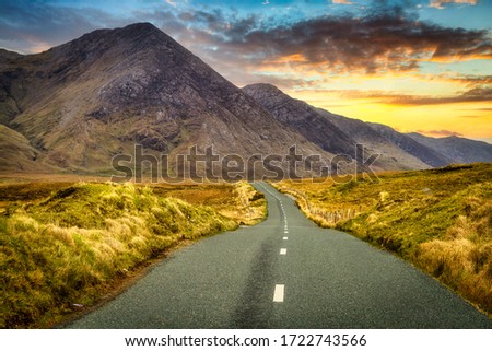 Twisty road in Connemara Moutains at sunset, Ireland