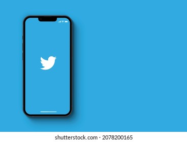 Twitter app on smartphone iPhone 13 Pro screen on blue background. Rio de Janeiro, RJ, Brazil. November 2021.