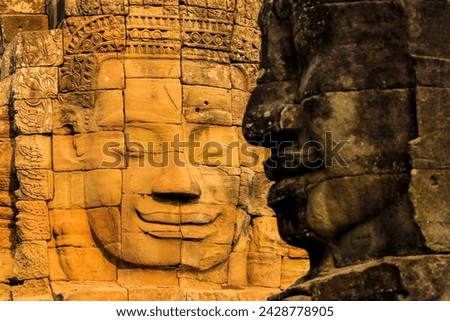 Two of 216 smiling sandstone faces at 12th century bayon, king jayavarman vii's last temple in angkor thom, angkor, unesco world heritage site, siem reap, cambodia, indochina, southeast asia, asia