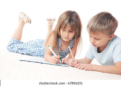 Two 6 Year Old Kids Drawing On The Floor