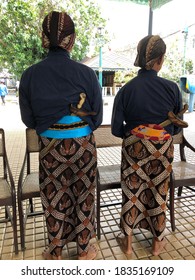 Two Abdi Dalem (royal Servant) Of Yogyakarta Palace With Their Uniform And Accessorries Are Welcoming The Guests