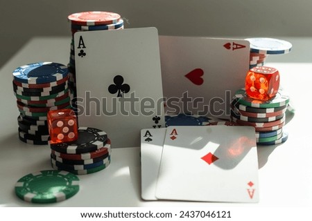 two aces in the hands of a close up. An concept Image of a poker table. two aces, two playing cards and poker chips on the green casino table on a black background. success in gambling. soft focus