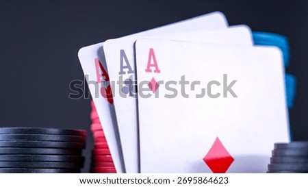 Two aces sit face up on a green felt poker table surrounded by black and red poker chips, along with a Bitcoin coin, capturing the thrill of a weekend game night.