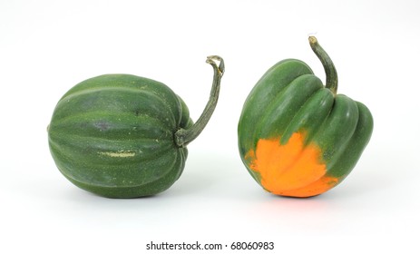 Two Acorn Squash Arranged On A White Background.