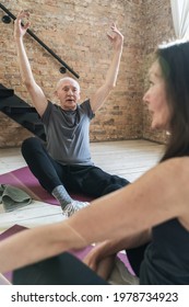 Two Active Elderly People During Fitness Or Yoga Workout At Home