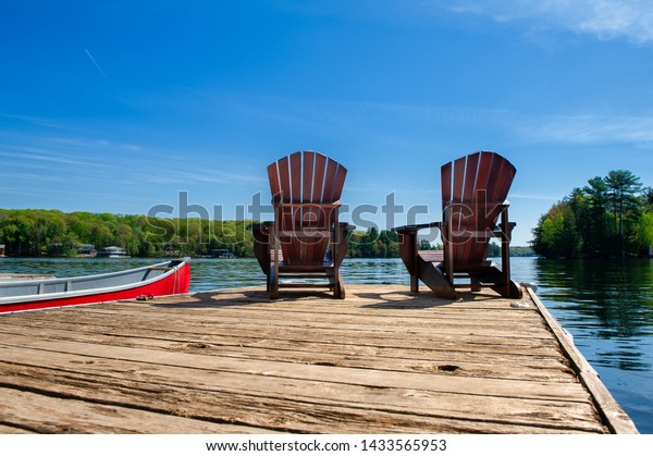 Two Adirondack Chairs On Wooden Dock Stock Photo Edit Now 1433565953
