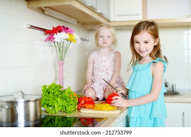 Two Adorable Little Sisters Cooking Dinner Stock Photo 212733799 ...