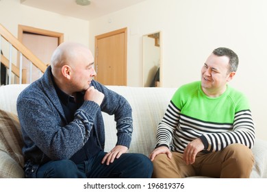 Two Adult  Friends  Talking At Home