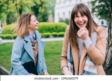 Two Adult Stylish Best Friends Female Sisters Having Fun, Laughing After Quarrel Outdoor In The City Park. Friendshop Apology Forgiveness, Empathy In Relations Concept.