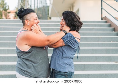 Two Adult Twin Sisters Playing With Each Other