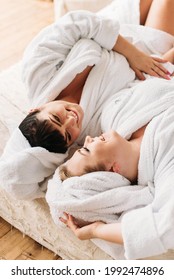 Two Adult Women Plus Size Models. Mom And Daughter Relax. A Great Family Day At The Spa. In Bathrobes And Towels