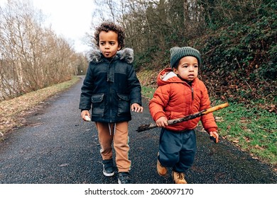 Two African American Children Explore The World Together On A Winter Day