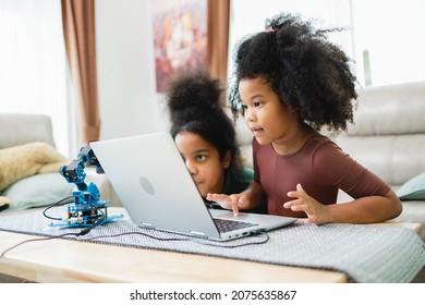 Two African American Girls Learned Robot Arms With A Program Computer. Innovative Technology Mechanical For Assistive Technology