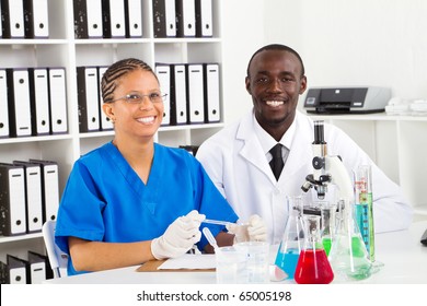 Two African American Lab Technicians Working In Lab