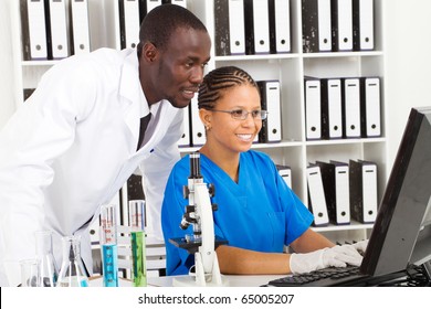 Two African American Scientists Working In Lab Together