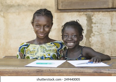 Two African Ethnicity Children Smiling Studying In A School Environment (Schooling Education Symbol)