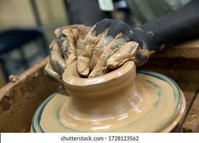 Two African Hands Doing Pottery