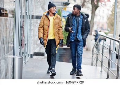 Two African Male Friends Talking Together, Wear On Jackets At Cold Weather.