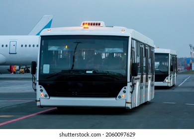 Two Airport Shuttle Buses At The Morning Airfield