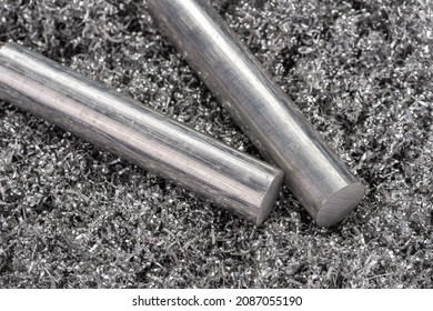 Two aluminum billets on shavings from miling machine. Industrial closeup photo. Side view photo of two metal rods on swirly aluminum shavings.  - Shutterstock ID 2087055190