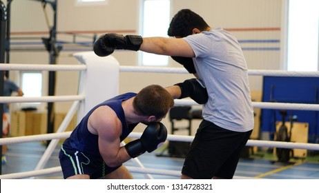 Two Amateur Boxer Boxing On The Ring In The Training Match