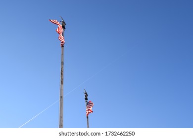 Two American flags flapping in the wind