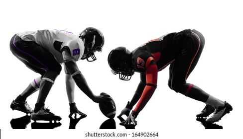 two american football players on scrimmage in silhouette shadow white background