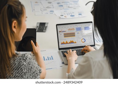 Two analyst women using KPI dashboard for data analytics. Digital data technology concept - Powered by Shutterstock