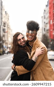 Two androgynous non binary people hugging each other sharing a moment of love and affection