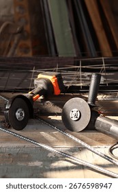 Two angle grinders close-up. Cordless and corded angle grinders, power tools for construction and repair work. Tools close-up. Repair work in the country. Grinders with metal discs