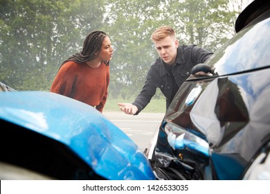 Two Angry Motorists Arguing Over Responsibility For Car Accident - Shutterstock ID 1426533035