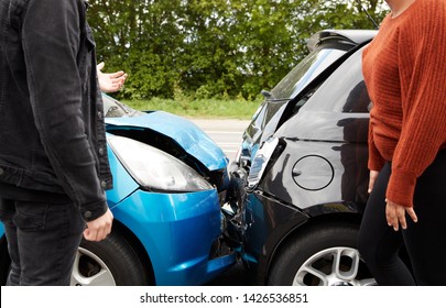 Two Angry Motorists Arguing Over Responsibility For Car Accident - Shutterstock ID 1426536851