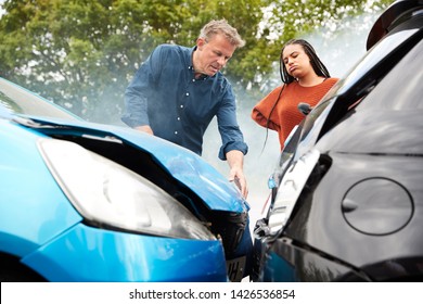 Two Angry Motorists Arguing Over Responsibility For Car Accident - Shutterstock ID 1426536854