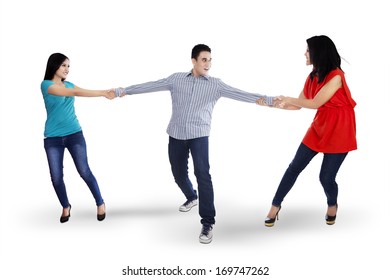 Two Angry Woman Fighting For A Man, Isolated Over White Background