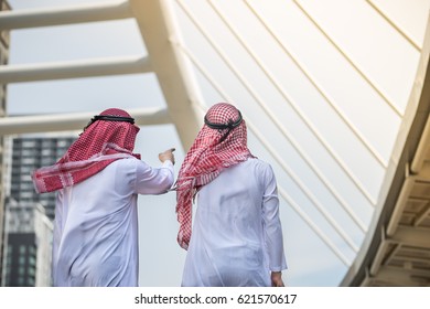 Two Arabian Businessman Looking And Pointing To The Ultimate Goal Of Project.