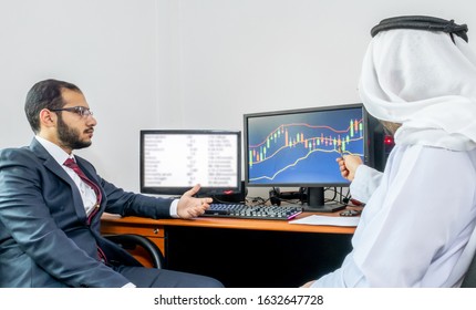 Two Arabic Muslim Men Discussing Market Trend And Stocks