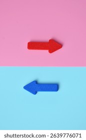 The two arrows point in different directions. It is a symbol of different approaches to life. Different paths