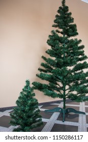 Two artificial pine Christmas tree