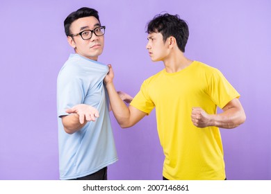 Two Asian Brothers Arguing With Each Other
