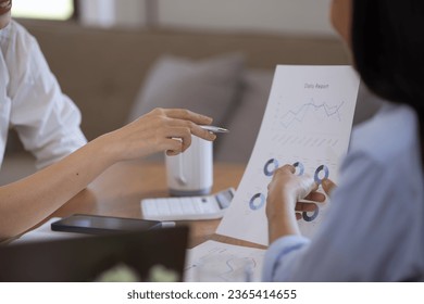 Two Asian businesswomen with friends and discussed their ideas at a meeting, Businesswoman talking with financial statement report together  at the office. - Shutterstock ID 2365414655