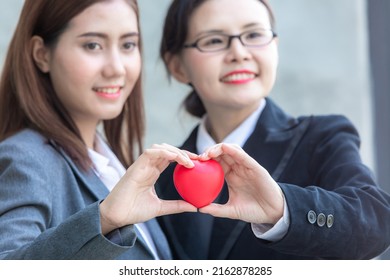 Two Asian Generation Z Women Lgbtq Lesbian With Red Heart Celebrate Annual In June Social Of Gay, Lesbian, Bisexual, Transgender, Human Rights