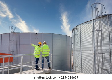 Two Asian male industrial engineers Work is planning work inspection work in the engineering industry. utilities Sewers and central wastewater treatment plants - Shutterstock ID 2154018689