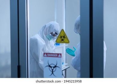 Two Asian Scientist Is Wearing Personal Protective Equipment (PPE) In Laboratory. Protection Coronavirus Or Covid19 And Medical Experiment Concept.