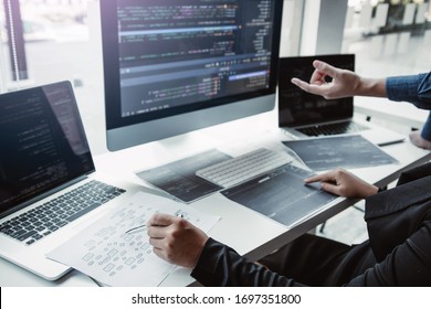 Two asian team working development of programming and encryption technology website design programmers on desk in office.