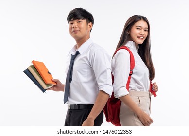 Two Asian Teenage Man And Woman Stand And Smile,woman Hold Red Back Pack Bag,man Hold Book In Hand,
Education Style.